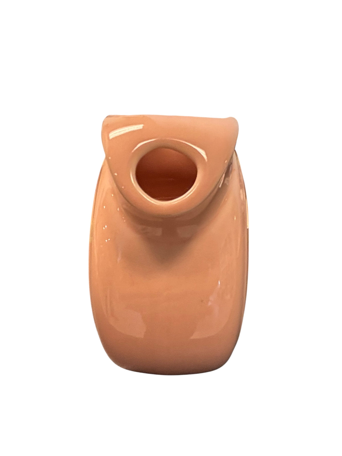 This is a Fiesta Fiestaware Small Disc Juice Pitcher in Apricot. lead-free, Post 1986, Retired Color Retired Shape 28 ounce capacity