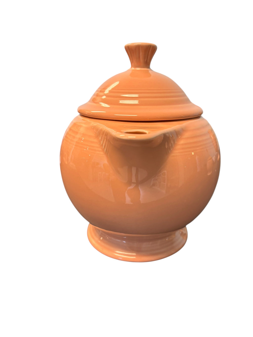 This is a Fiesta Fiestaware Five-cup 5-cup Ring Handled Tea Pot with Lid in Apricot. lead-free, Post 1986, Retired Color Retired Shape