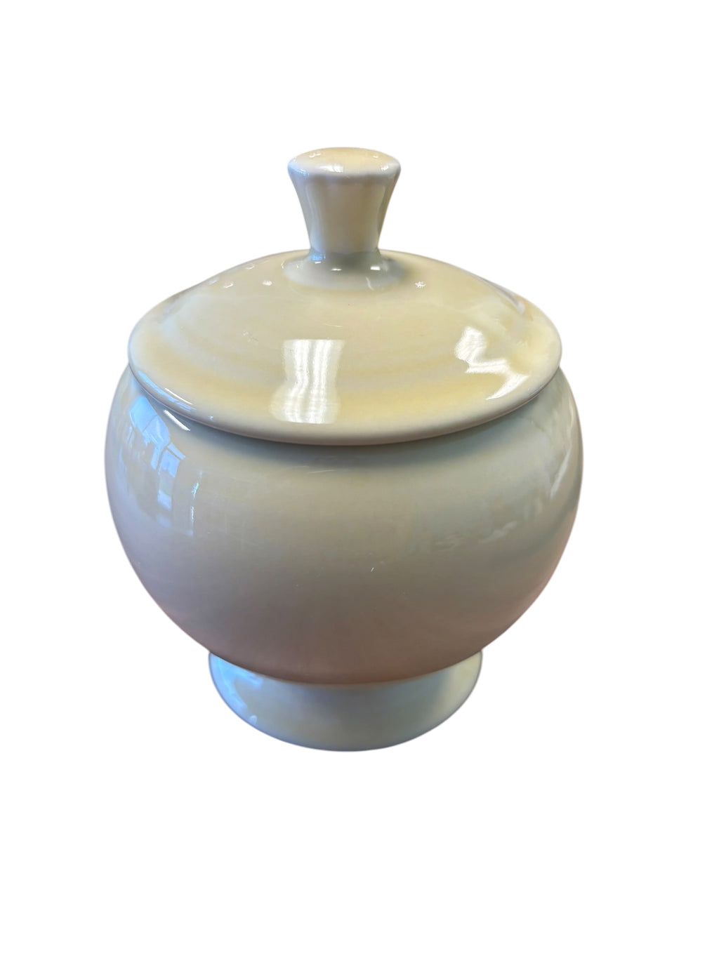 This is a Fiesta Fiestaware Individual Sugar Bowl With Lid in Ivory. lead-free, Post 1986, Retired Color Retired Shape
