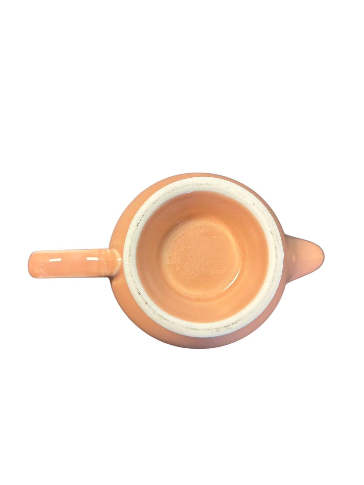 This is a Fiesta Fiestaware individual cream pitcher creamer in Apricot. lead-free, Post 1986, Retired Color Retired Shape