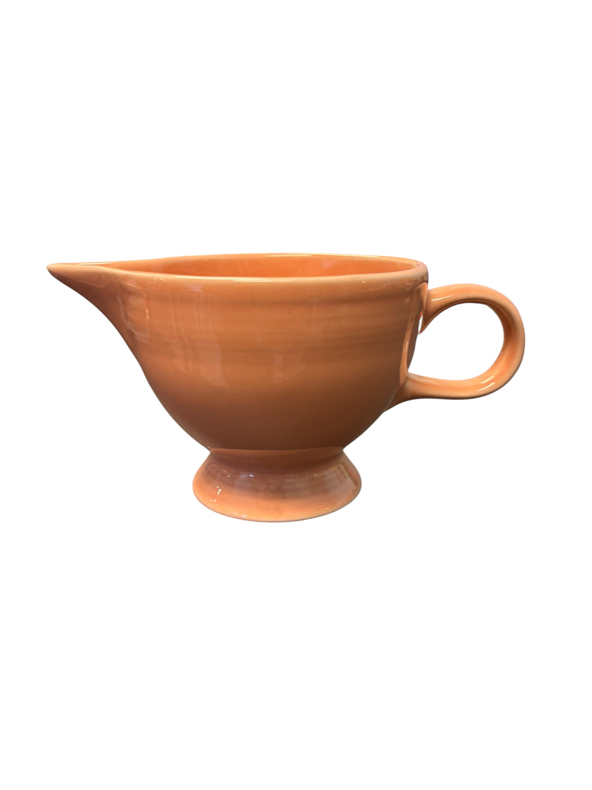 This is a Fiesta Fiestaware individual cream pitcher creamer in Apricot. lead-free, Post 1986, Retired Color Retired Shape