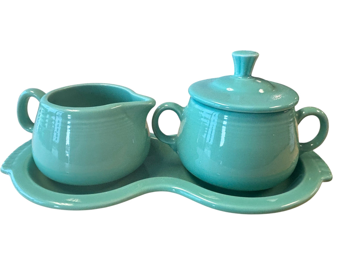 This is a Fiesta Fiestaware Creamer Pitcher Sugar Bowl with Lid on Figure Eight 8 Tray Set in Sea Mist Green. lead-free, Post 1986, Retired Color Retired Shape
