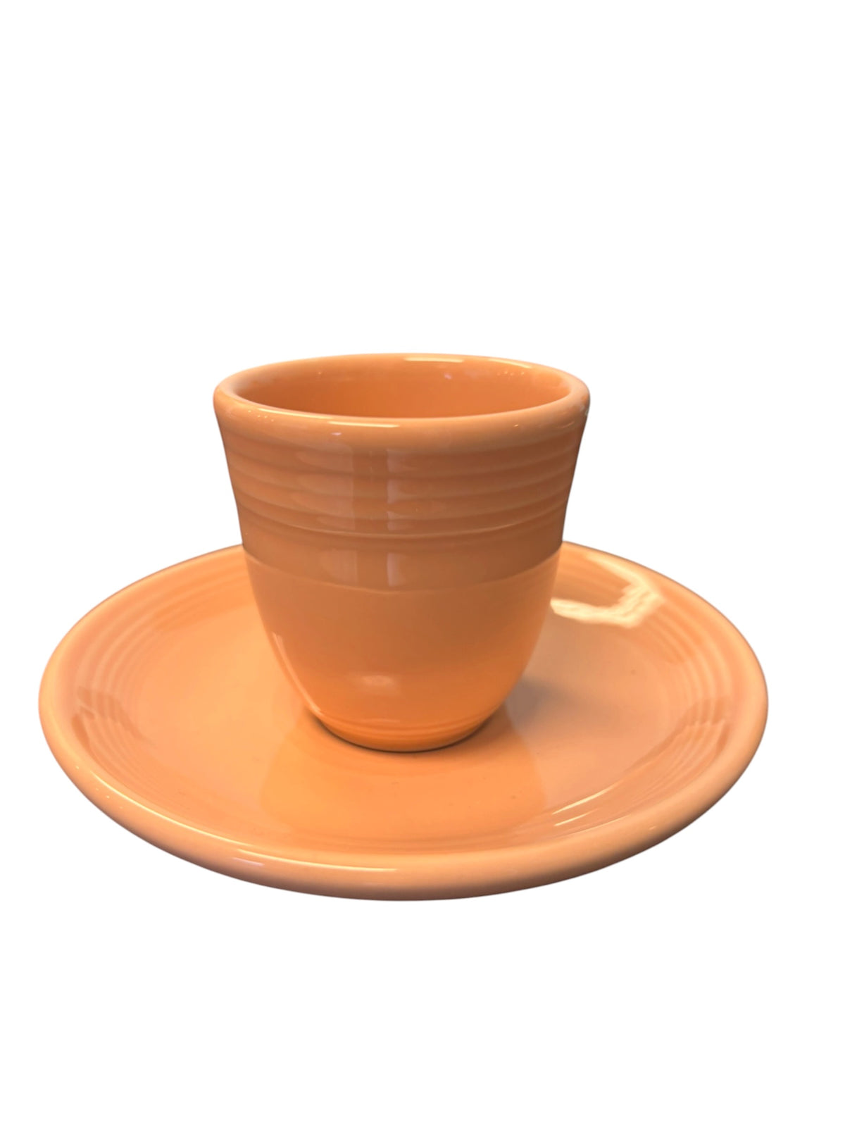 This is a Fiesta Fiestaware After Dinner AD Stick Handled Demitasse Demi Cup and Saucer Set in Apricot. lead-free, Post 1986, Retired Color Retired Shape Perfect for Espresso