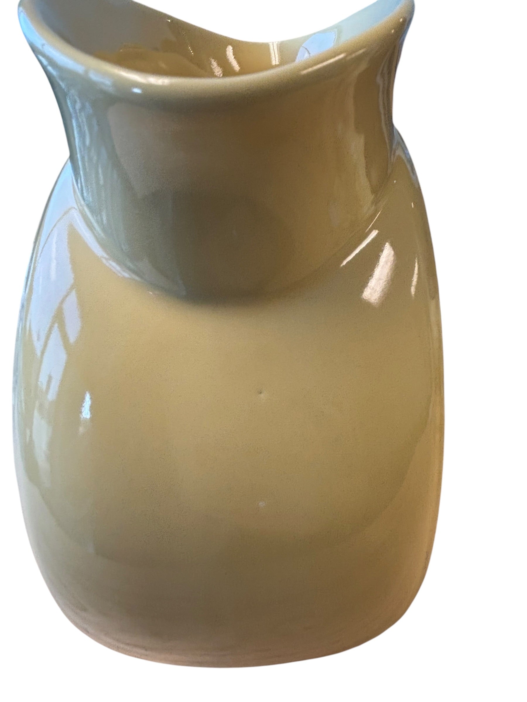 A glossy ceramic pitcher or small vase with a rounded body and flared rim, shown on a plain white background. Fiesta Millennium II Vase Sand Bumo