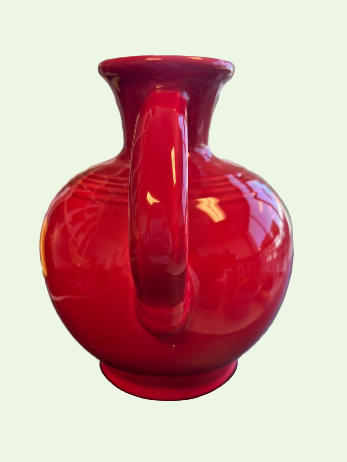 This is a Fiesta Fiestware small 60 Ounce Carafe in scarlet. Lead-free Post 1986 retired shape
