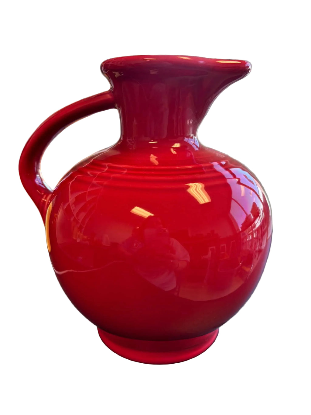This is a Fiesta Fiestware small 60 Ounce Carafe in scarlet. Lead-free Post 1986 retired shape
