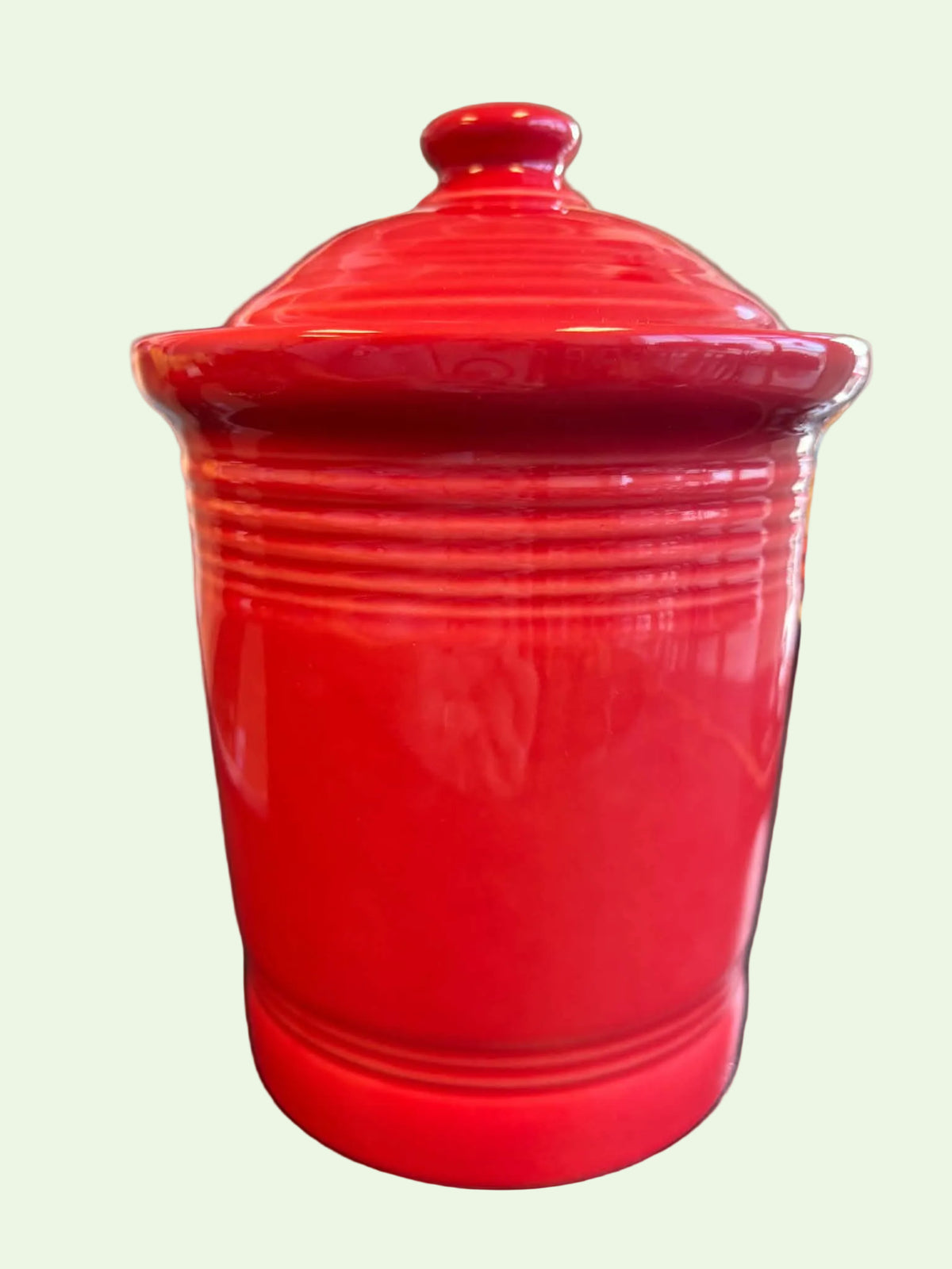 This is a Fiesta Fiestware small 1 quart classic shaped canister in scarlet. Lead-free Post 1986 Retired Shape
