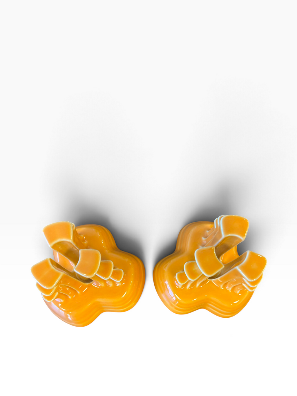 Fiesta pyramid candle holders are collectible, tripod-shaped ceramic candle pieces produced in limited, numbered runs by the iconic tabletop brand. These are in the beautiful tangerine orange glaze. 