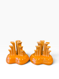 Fiesta pyramid candle holders are collectible, tripod-shaped ceramic candle pieces produced in limited, numbered runs by the iconic tabletop brand. These are in the beautiful tangerine orange glaze. 