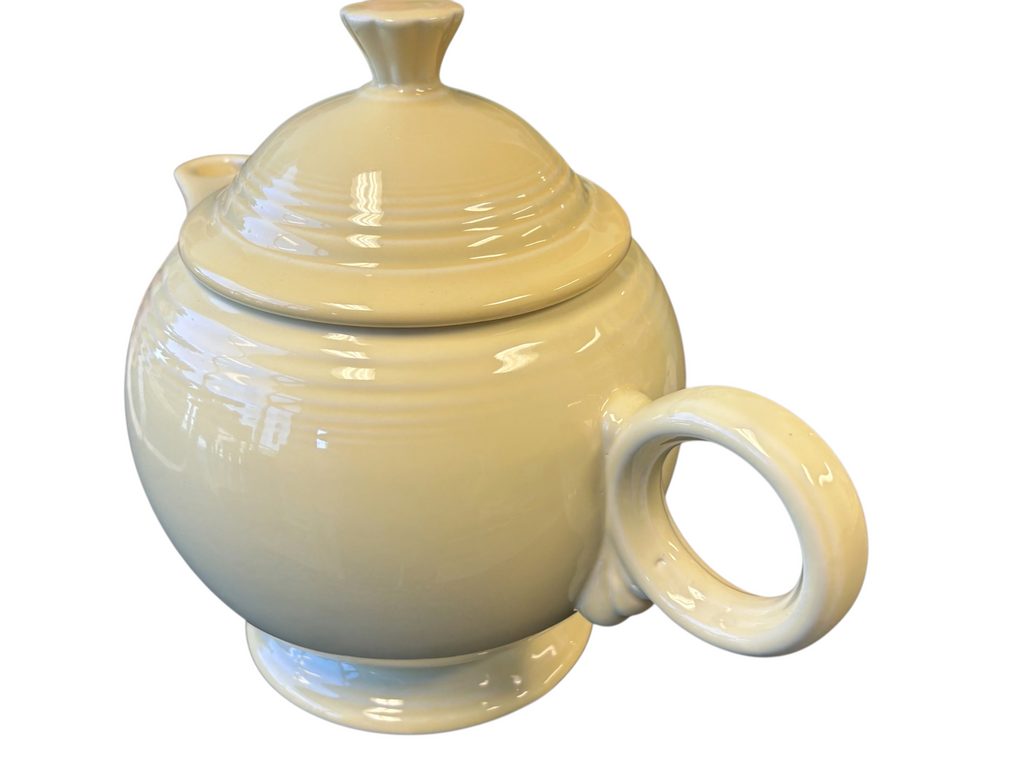 This is a Fiesta Fiestaware Five-cup 5-cup Ring Handled Tea Pot with Lid in Yellow. lead-free, Post 1986, Retired Color Retired Shape
