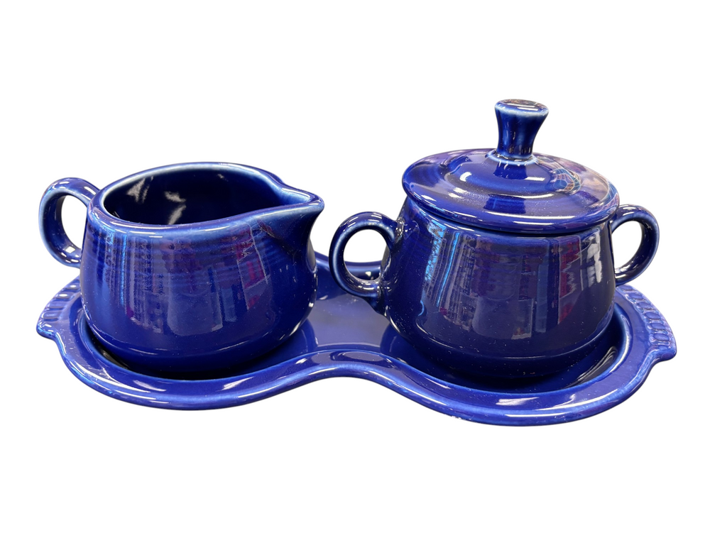 This is a Fiesta Fiestaware Creamer Pitcher Sugar Bowl with Lid on Figure Eight 8 Tray Set in twilight lead-free, Post 1986, Retired Color Retired Shape

