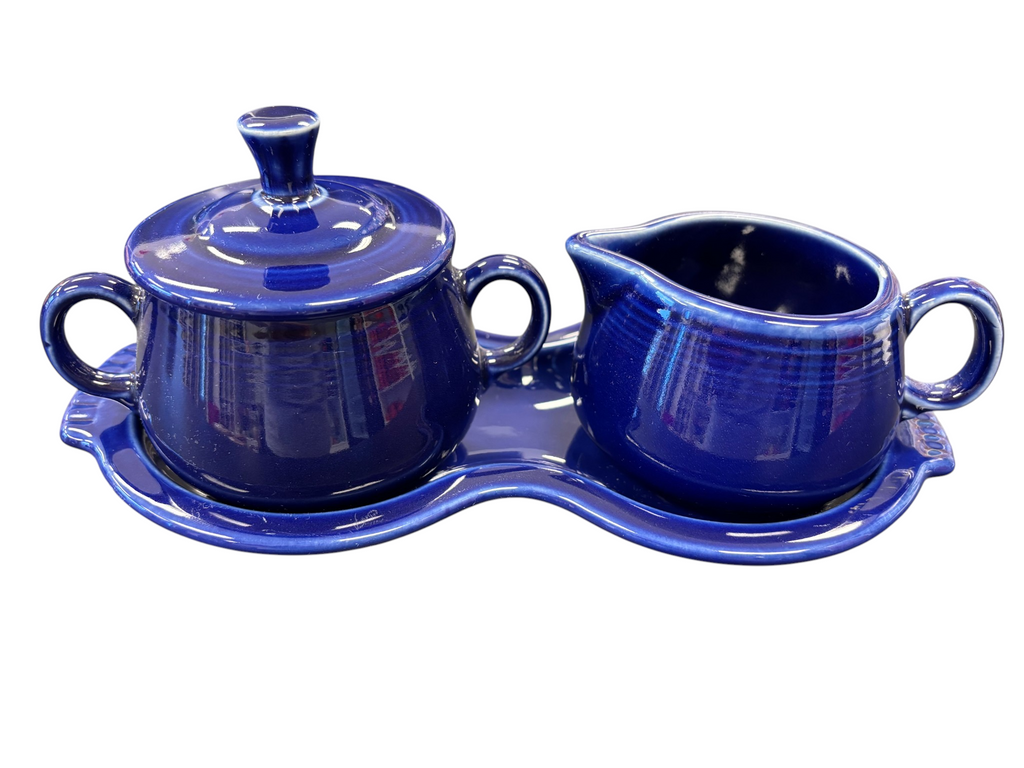 This is a Fiesta Fiestaware Creamer Pitcher Sugar Bowl with Lid on Figure Eight 8 Tray Set in twilight lead-free, Post 1986, Retired Color Retired Shape
