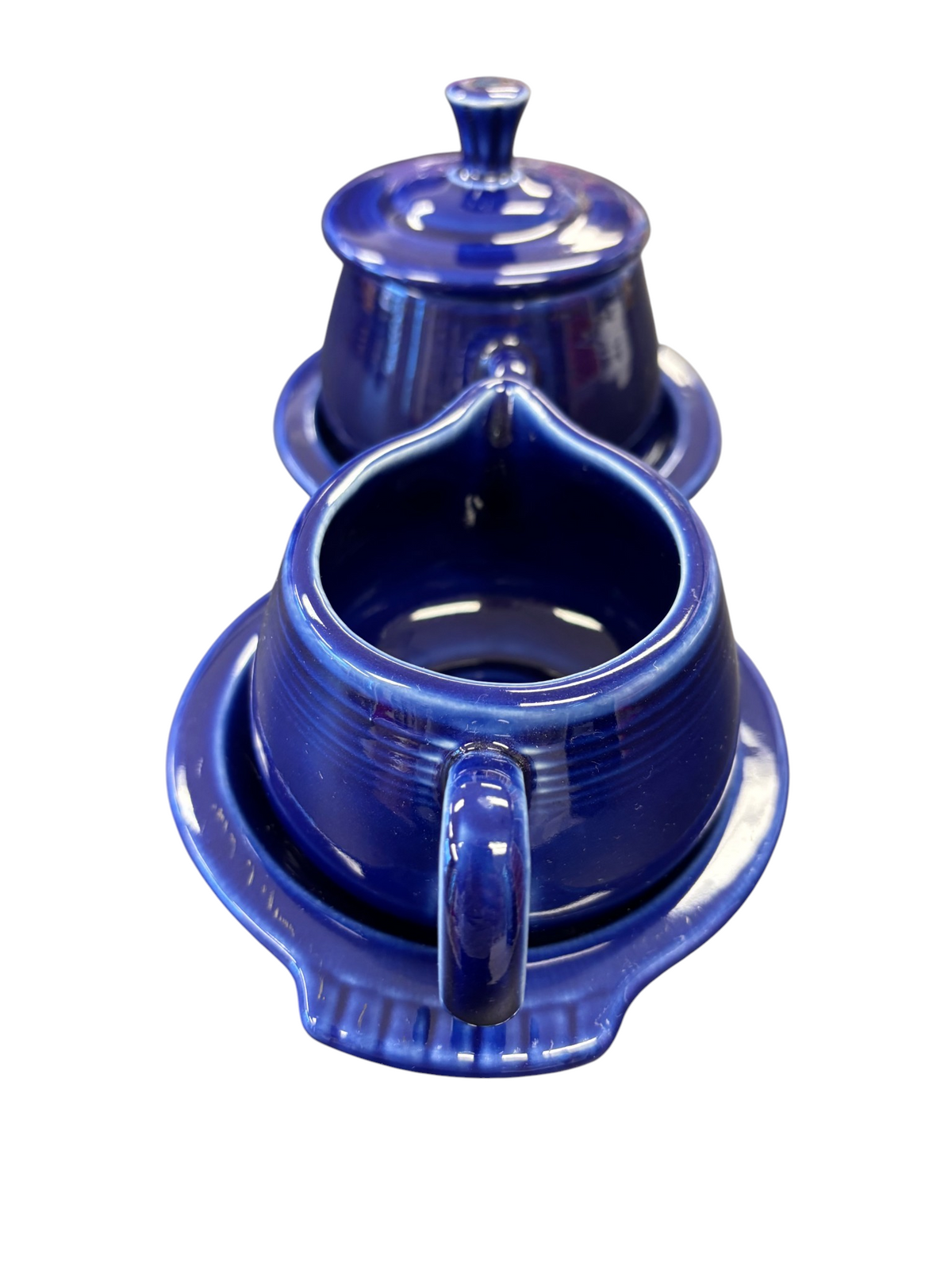 This is a Fiesta Fiestaware Creamer Pitcher Sugar Bowl with Lid on Figure Eight 8 Tray Set in twilight lead-free, Post 1986, Retired Color Retired Shape
