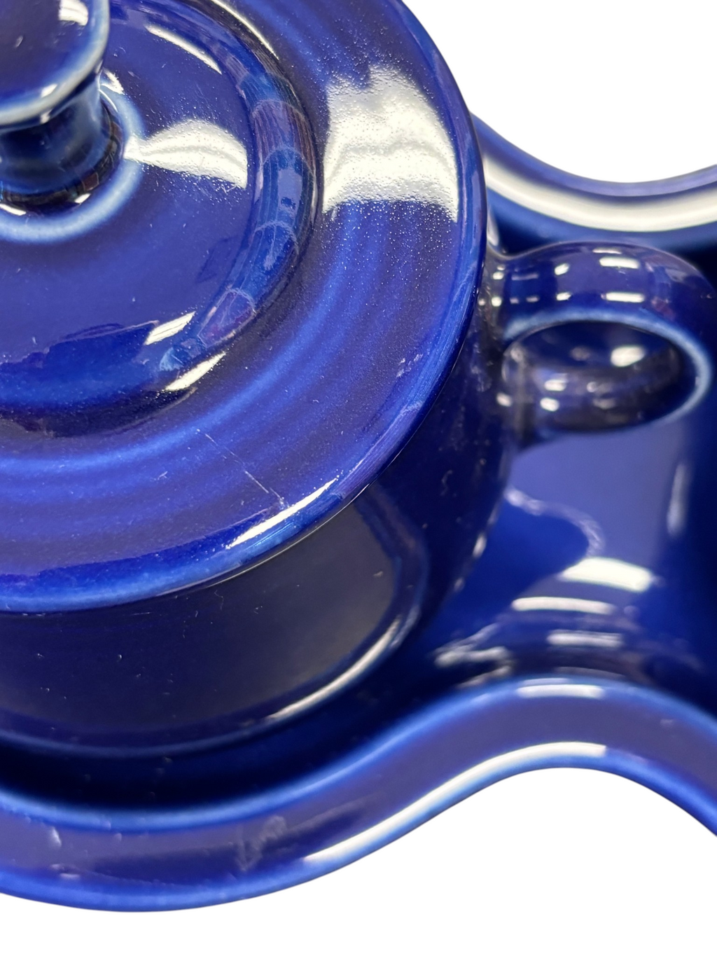 This is a Fiesta Fiestaware Creamer Pitcher Sugar Bowl with Lid on Figure Eight 8 Tray Set in twilight lead-free, Post 1986, Retired Color Retired Shape
