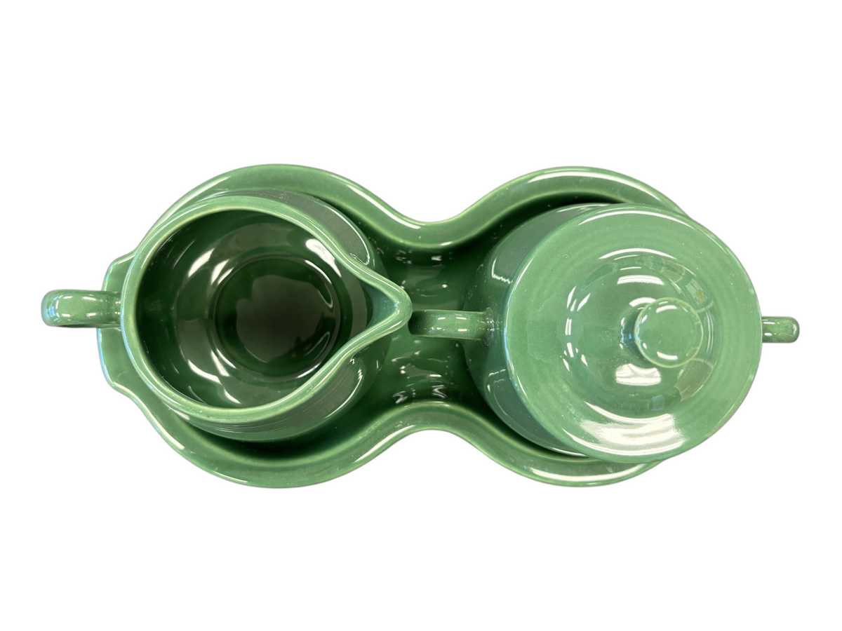 This is a Fiesta Fiestaware Creamer Pitcher Sugar Bowl with Lid on Figure Eight 8 Tray Set in jade lead-free, Post 1986, Retired Shape
