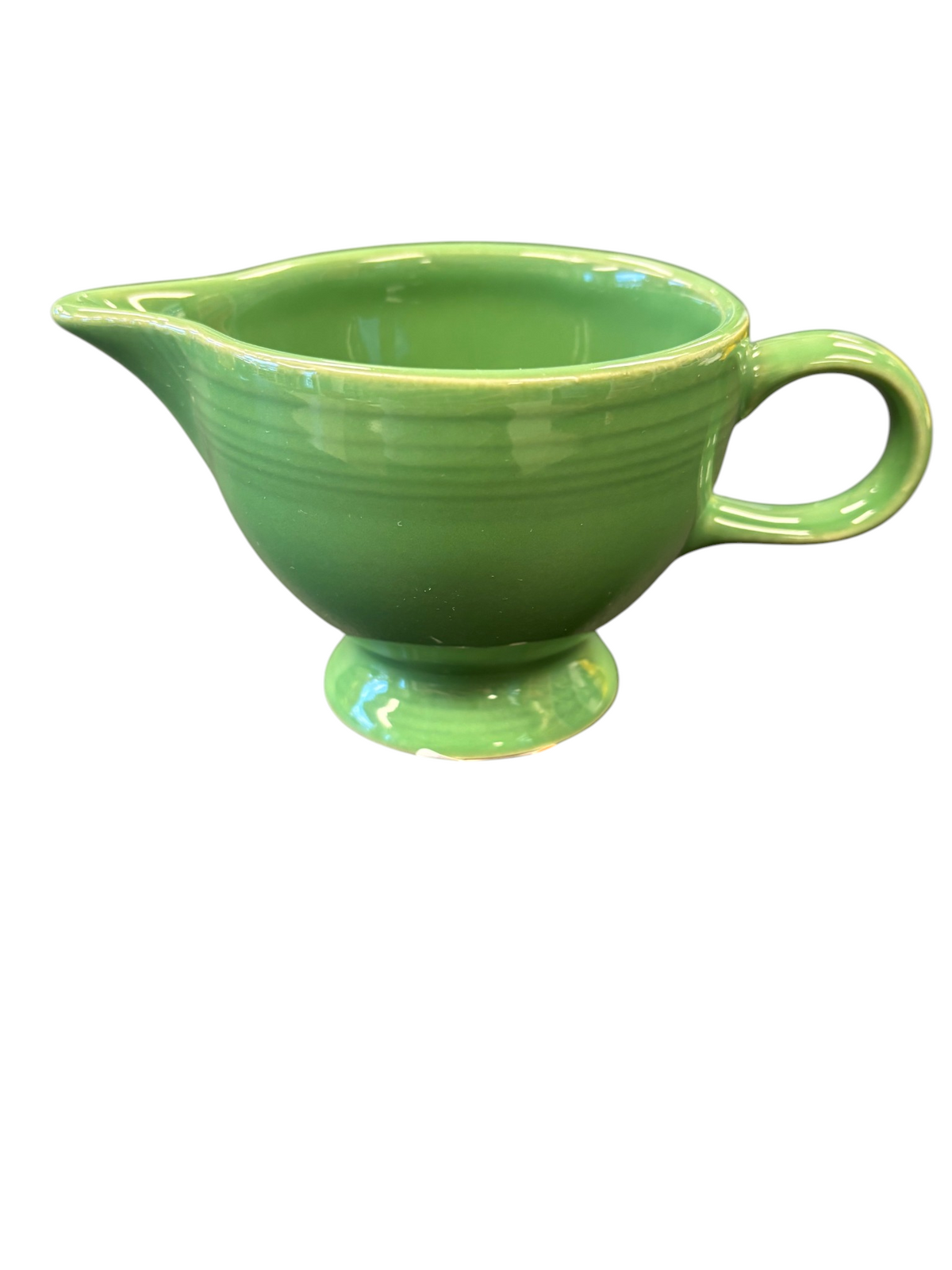 This is a Fiesta Fiestaware individual cream pitcher creamer in Meadow. lead-free, Post 1986, Retired Shape
