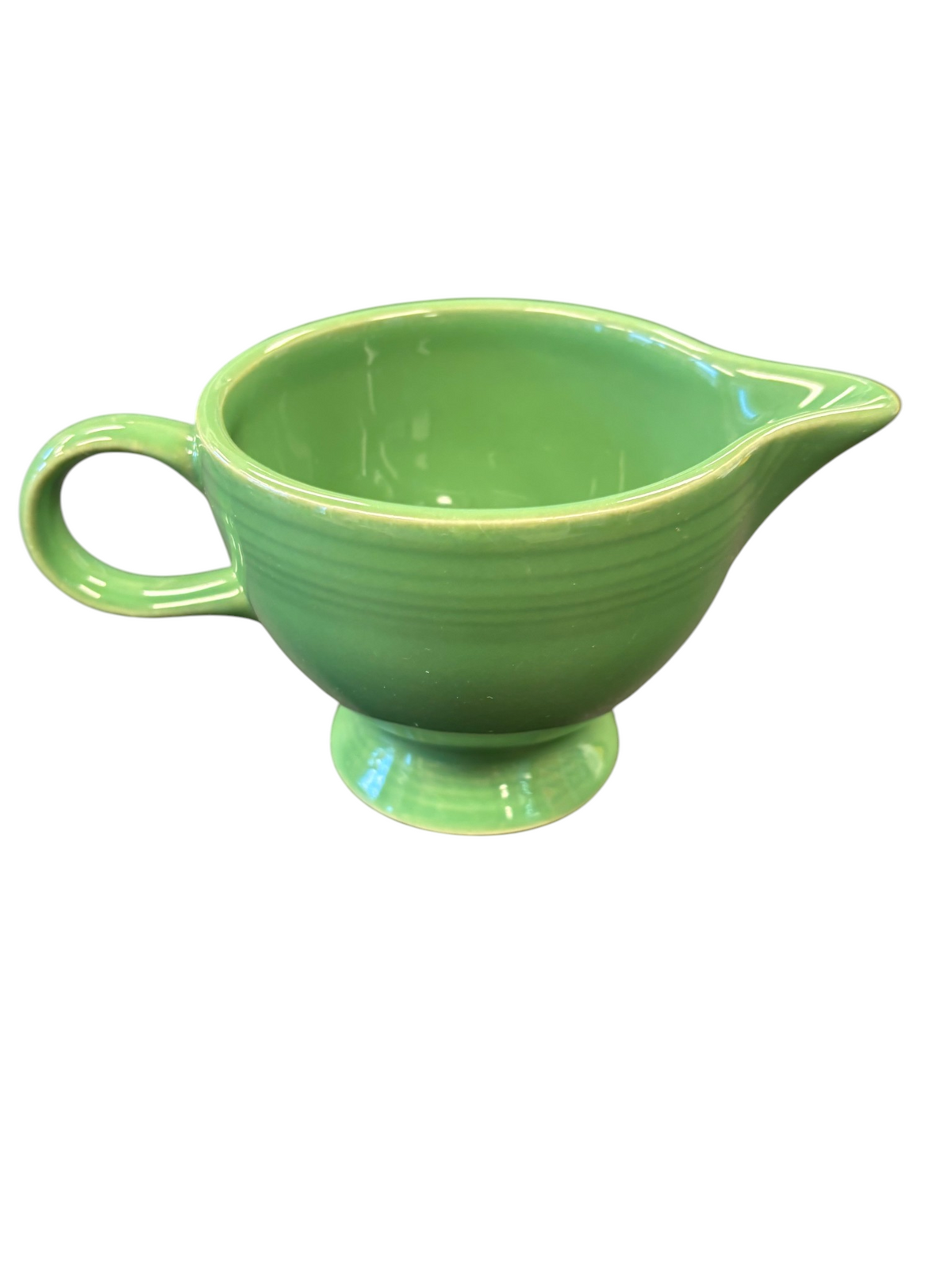 This is a Fiesta Fiestaware individual cream pitcher creamer in Meadow. lead-free, Post 1986, Retired Shape
