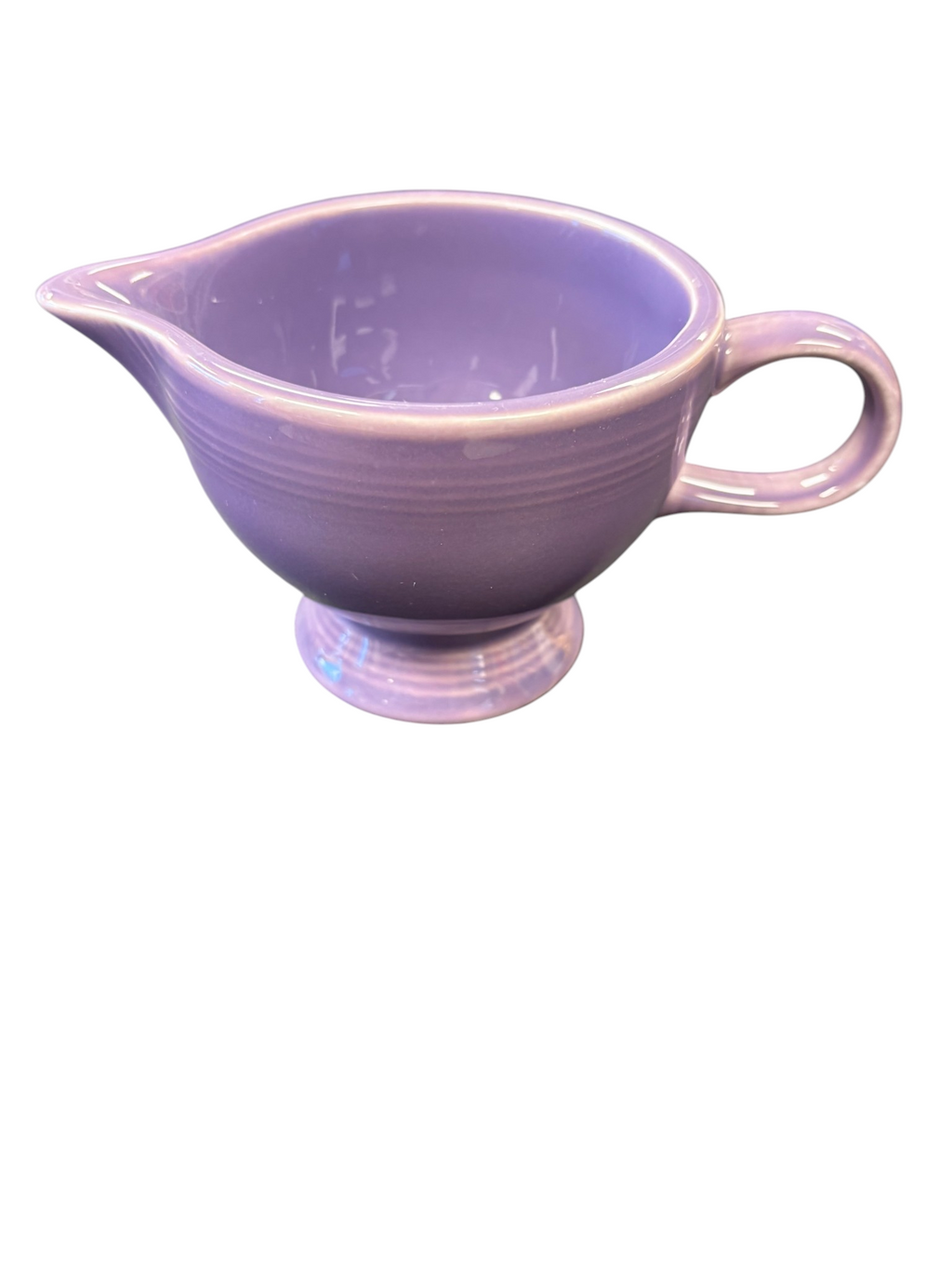 This is a Fiesta Fiestaware individual cream pitcher creamer in Lilac. lead-free, Post 1986, Retired Color Retired Shape
