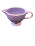 This is a Fiesta Fiestaware individual cream pitcher creamer in Lilac. lead-free, Post 1986, Retired Color Retired Shape
