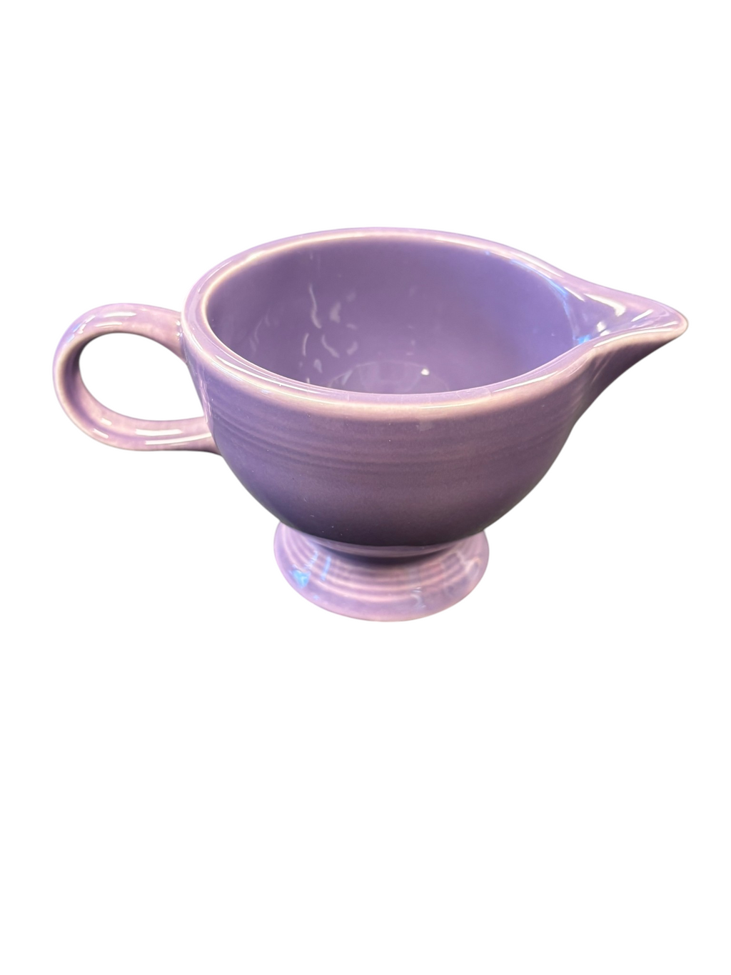 This is a Fiesta Fiestaware individual cream pitcher creamer in Lilac. lead-free, Post 1986, Retired Color Retired Shape
