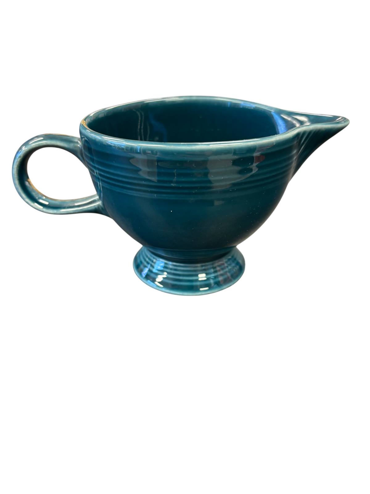 This is a Fiesta Fiestaware individual cream pitcher creamer in Juniper. lead-free, Post 1986, Retired Color Retired Shape
