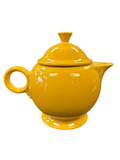 This is a Fiesta Fiestaware Five-cup 5-cup Ring Handled Tea Pot with Lid in Marigold. lead-free, Post 1986, Retired Color Retired Shape
