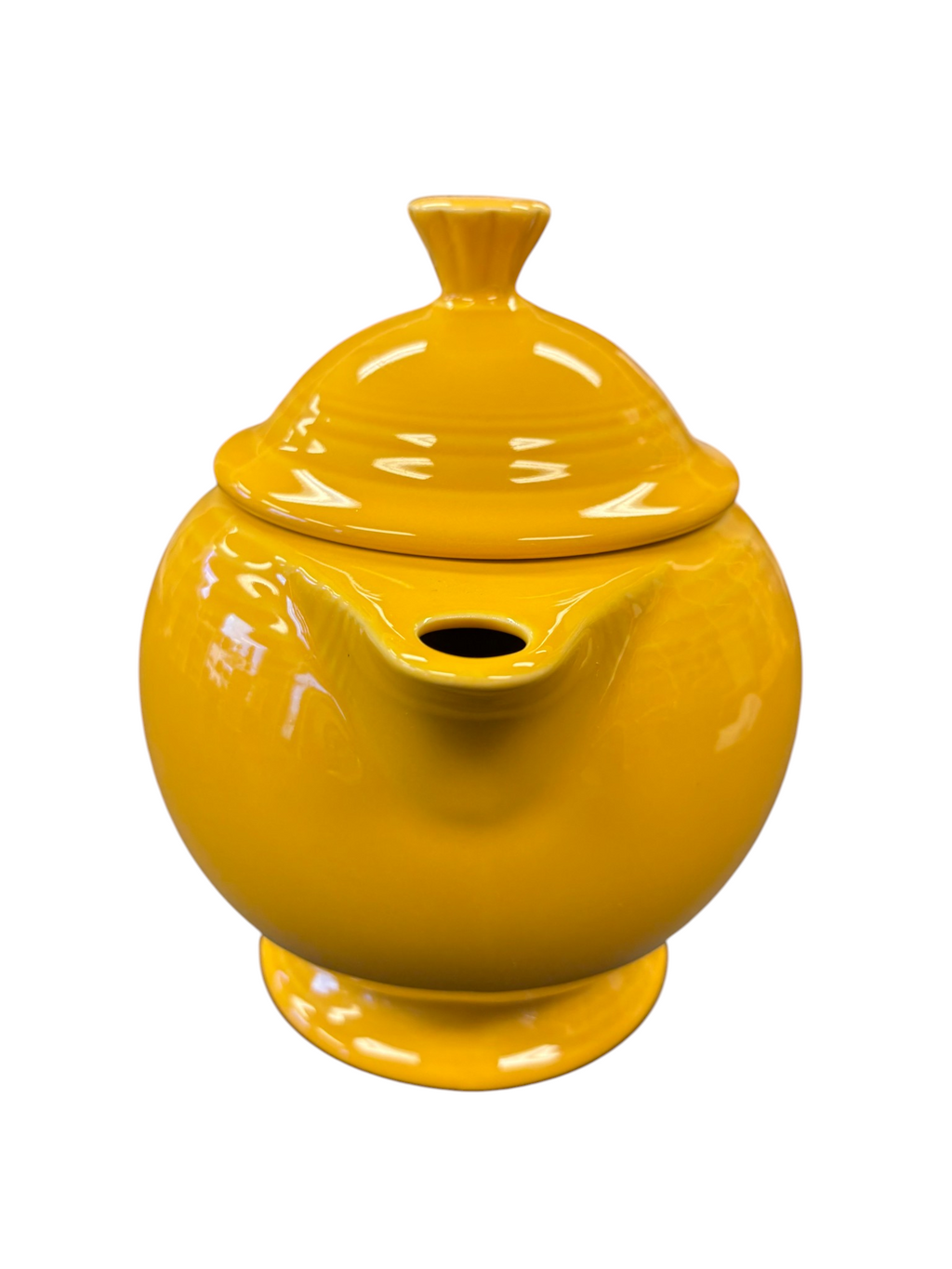 This is a Fiesta Fiestaware Five-cup 5-cup Ring Handled Tea Pot with Lid in Marigold. lead-free, Post 1986, Retired Color Retired Shape
