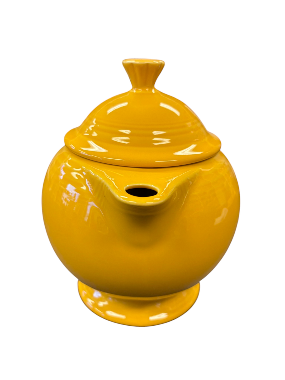 This is a Fiesta Fiestaware Five-cup 5-cup Ring Handled Tea Pot with Lid in Marigold. lead-free, Post 1986, Retired Color Retired Shape

