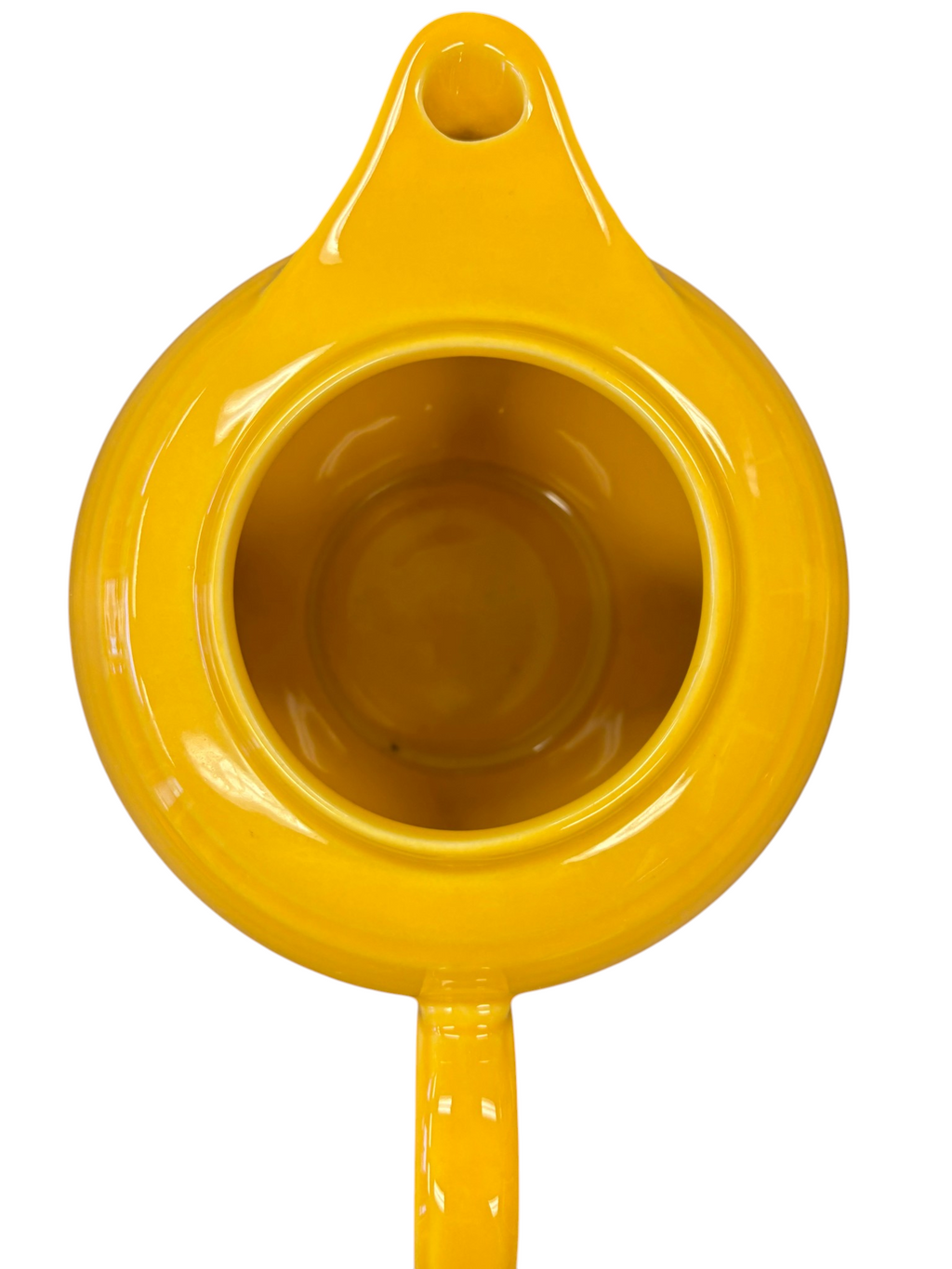 This is a Fiesta Fiestaware Five-cup 5-cup Ring Handled Tea Pot with Lid in Marigold. lead-free, Post 1986, Retired Color Retired Shape
