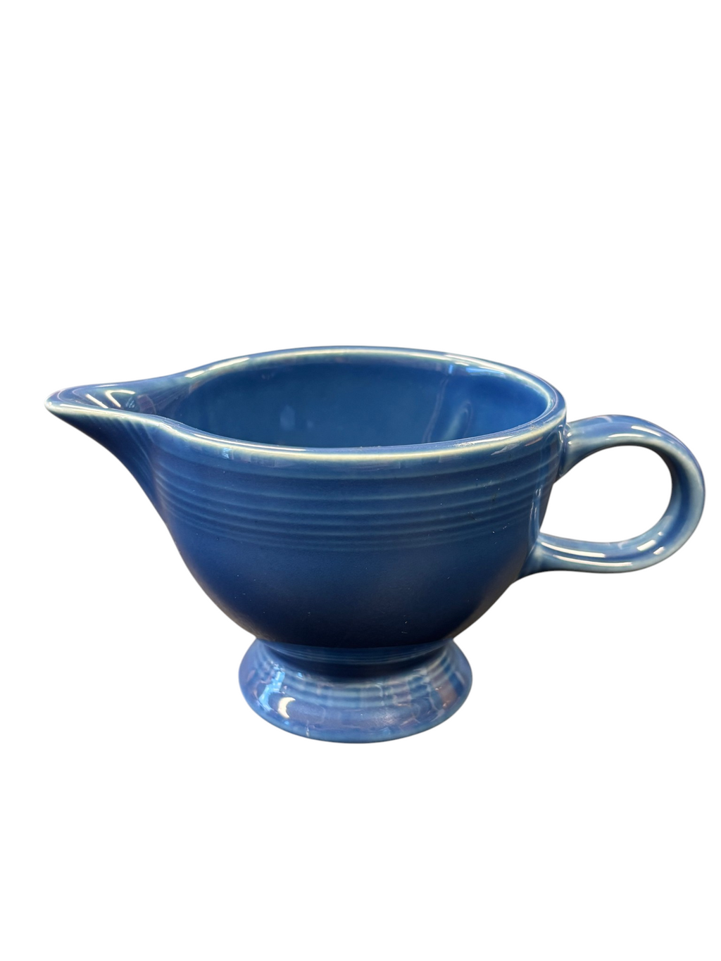 This is a Fiesta Fiestaware individual cream pitcher creamer in Lapis. lead-free, Post 1986, Retired Shape
