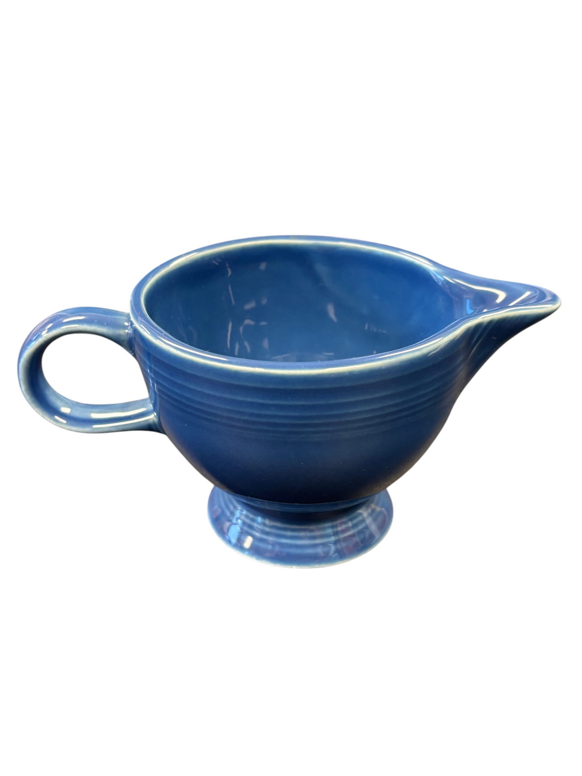 This is a Fiesta Fiestaware individual cream pitcher creamer in Lapis. lead-free, Post 1986, Retired Shape
