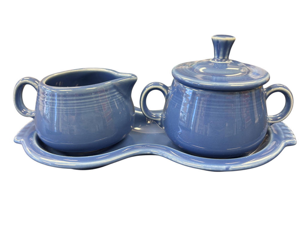 This is a Fiesta Fiestaware Creamer Pitcher Sugar Bowl with Lid on Figure Eight 8 Tray Set in lapis lead-free, Post 1986, Retired Shape
