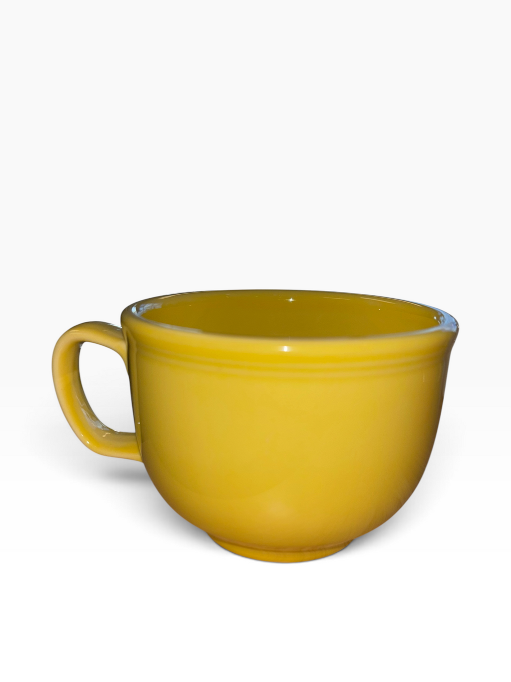 This is a Fiesta fiestaware Jumbo Mug featuring the Whoo Owl decal on sunflower. Lead free, Post 1986, Halloween, Retired Color, Retired Decal.
