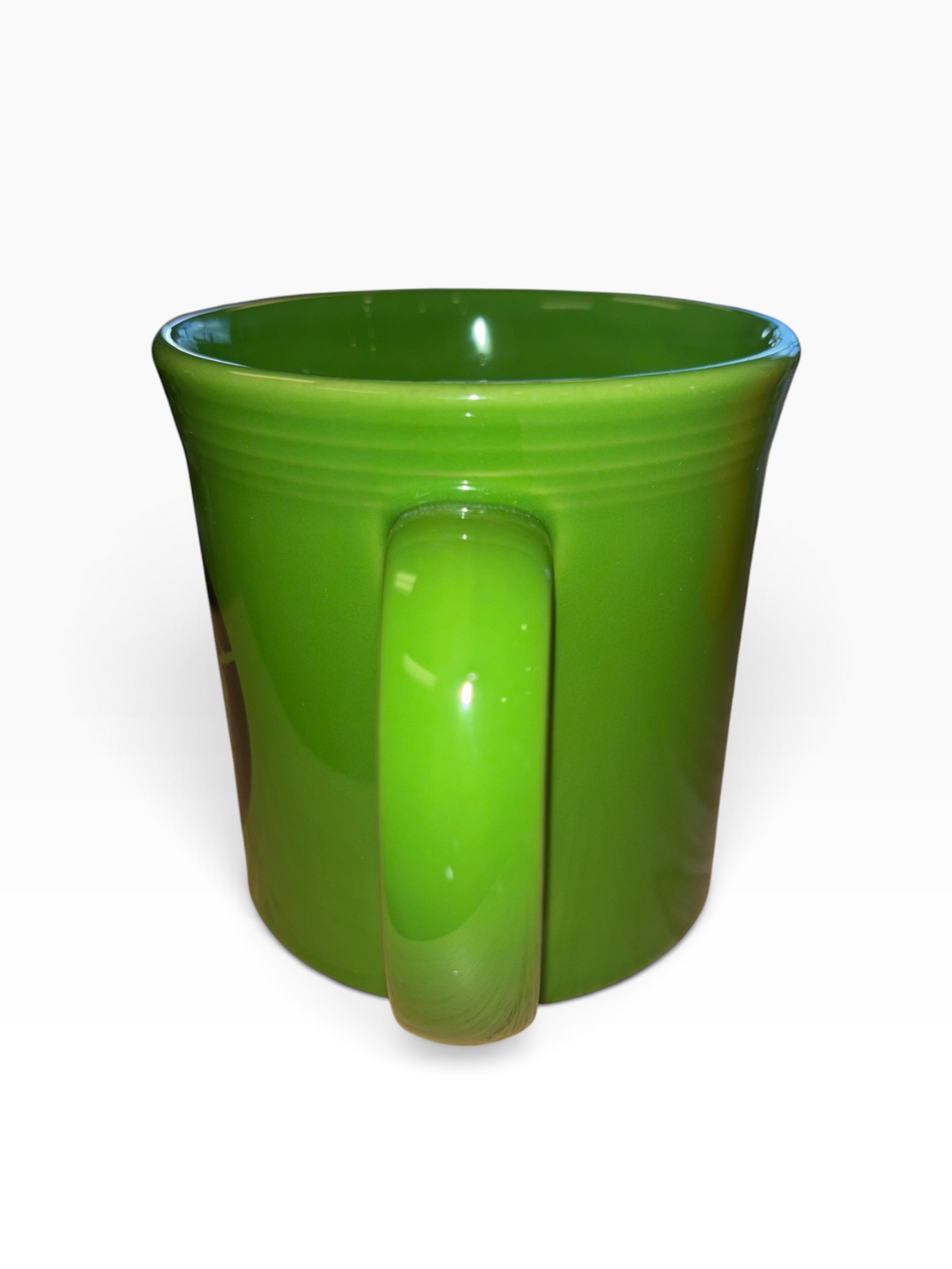 This is a Fiesta fiestware Java Mug featuring the Harvest Moon Witch decal on shamrock. Lead free Post 1986 Retired Color Retired Decal Halloween
