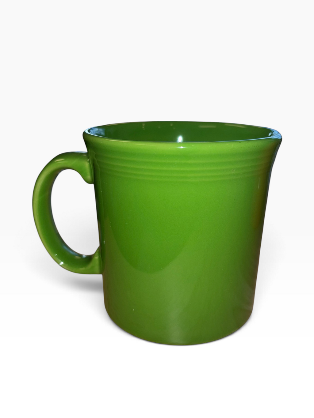 This is a Fiesta fiestware Java Mug featuring the Harvest Moon Witch decal on shamrock. Lead free Post 1986 Retired Color Retired Decal Halloween
