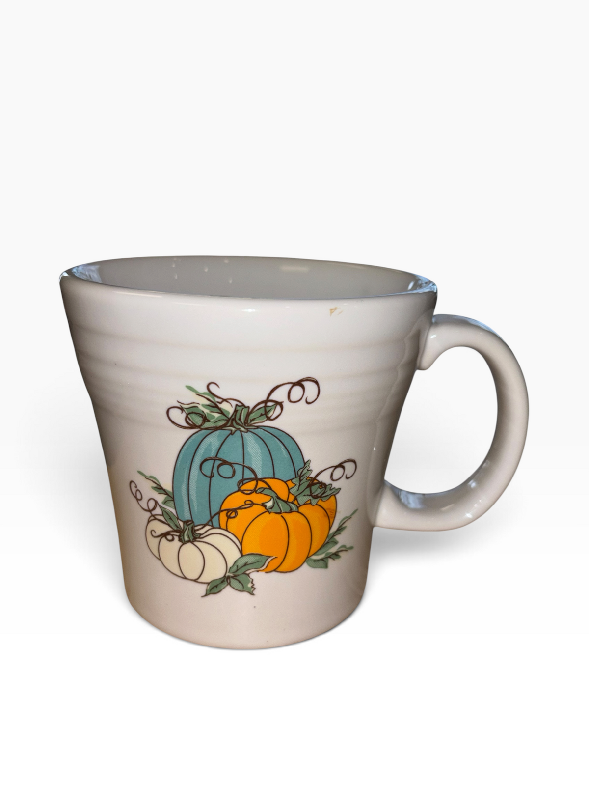 This is a Fiesta fiestaware Tapered Mug featuring the Belk Exclusive Pumpkin Trio decal on white. Lead free, post 1986,  retired decal, Halloween, Fall, Pumpkin, Thanksgiving
