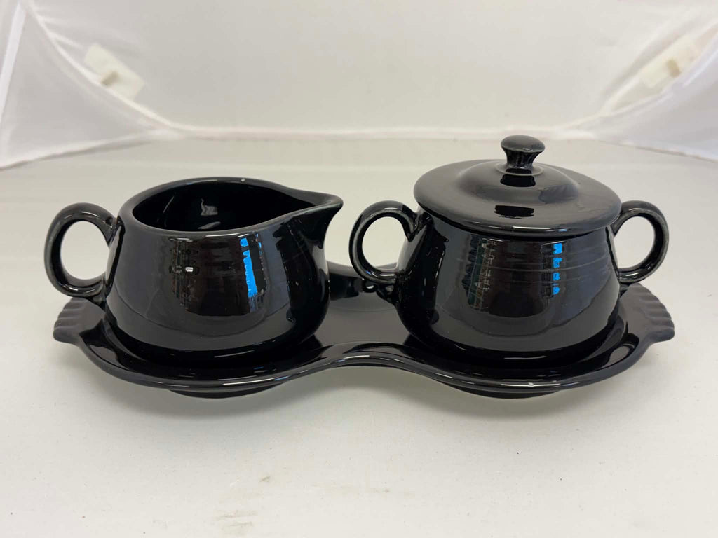 This is a Fiesta Fiestaware Creamer Pitcher Sugar Bowl with Lid on Figure Eight 8 Tray Set in black. lead-free, Post 1986, Retired Color Retired Shape
