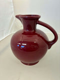 This is a Fiesta Fiestware small 60 Ounce Carafe in cinnabar. Lead-free Post 1986 Retired color retired shape
