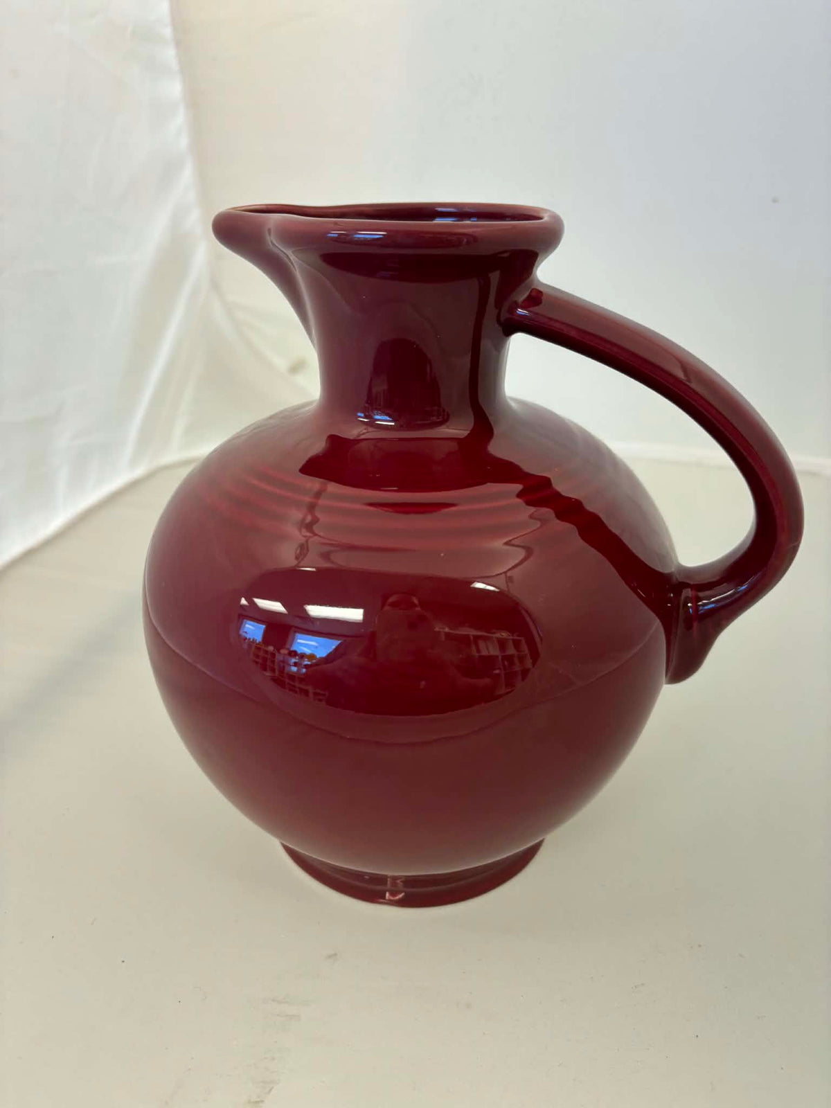 This is a Fiesta Fiestware small 60 Ounce Carafe in cinnabar. Lead-free Post 1986 Retired color retired shape
