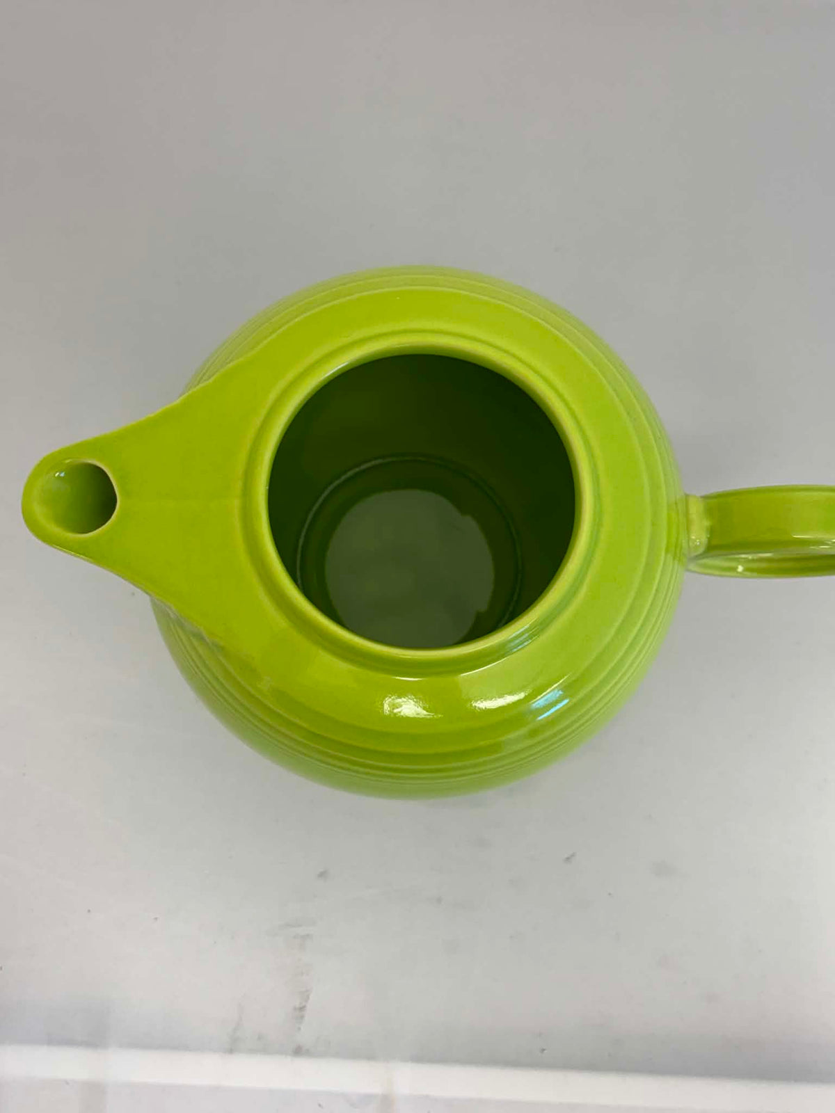This is a Fiesta Fiestaware Five-cup 5-cup Ring Handled Tea Pot with Lid in Chartreuse. lead-free, Post 1986, Retired Color Retired Shape
