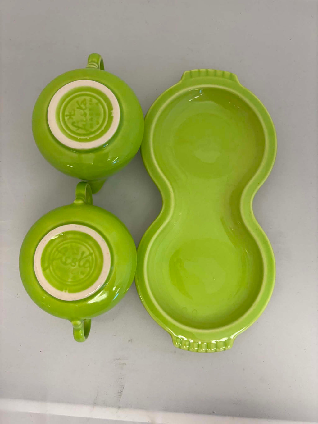 This is a Fiesta Fiestaware Creamer Pitcher Sugar Bowl with Lid on Figure Eight 8 Tray Set in chartreuse lead-free, Post 1986, Retired Color Retired Shape
