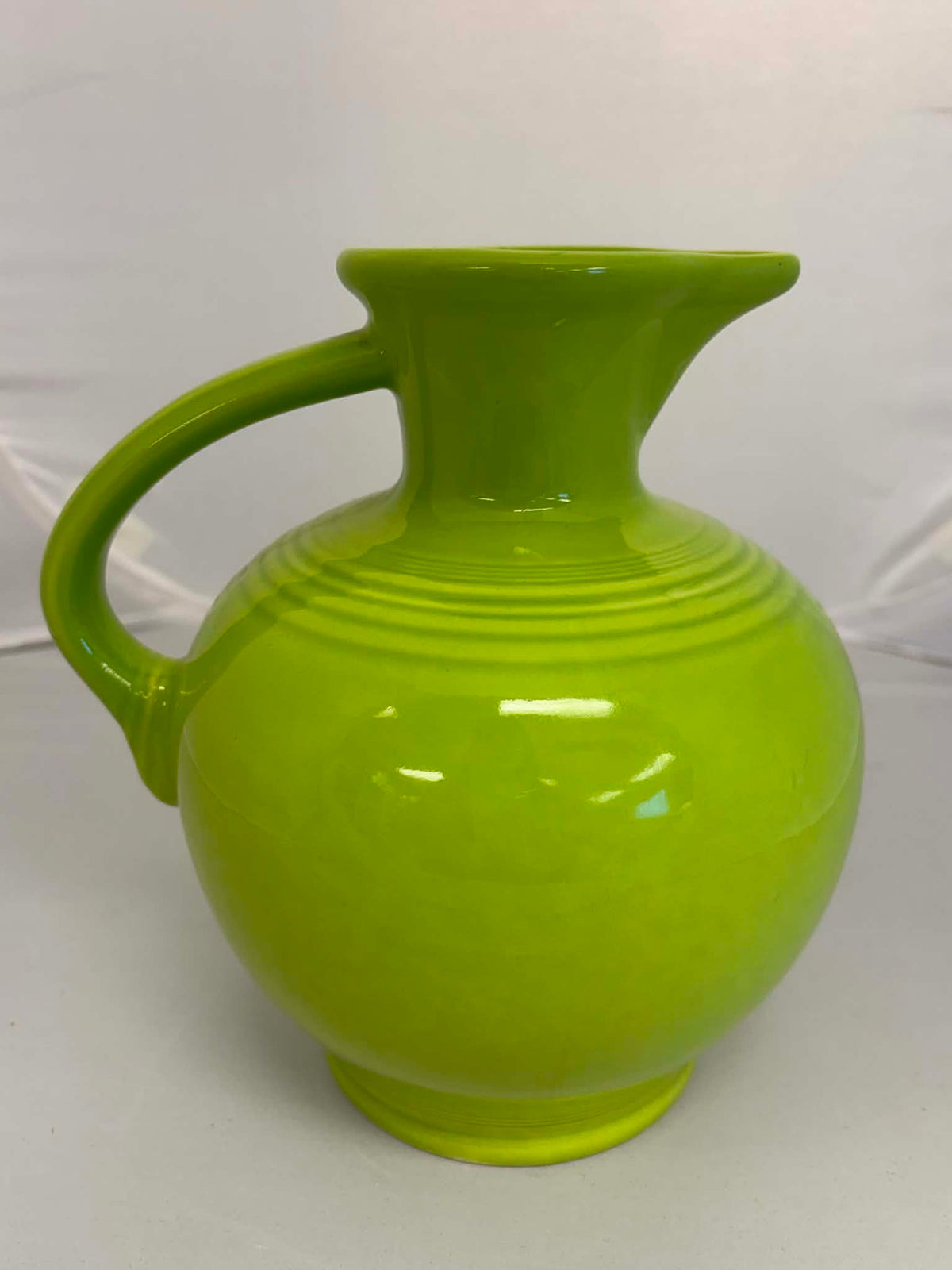This is a Fiesta Fiestware small 60 Ounce Carafe in chartreuse. Lead-free Post 1986 Retired color retired shape
