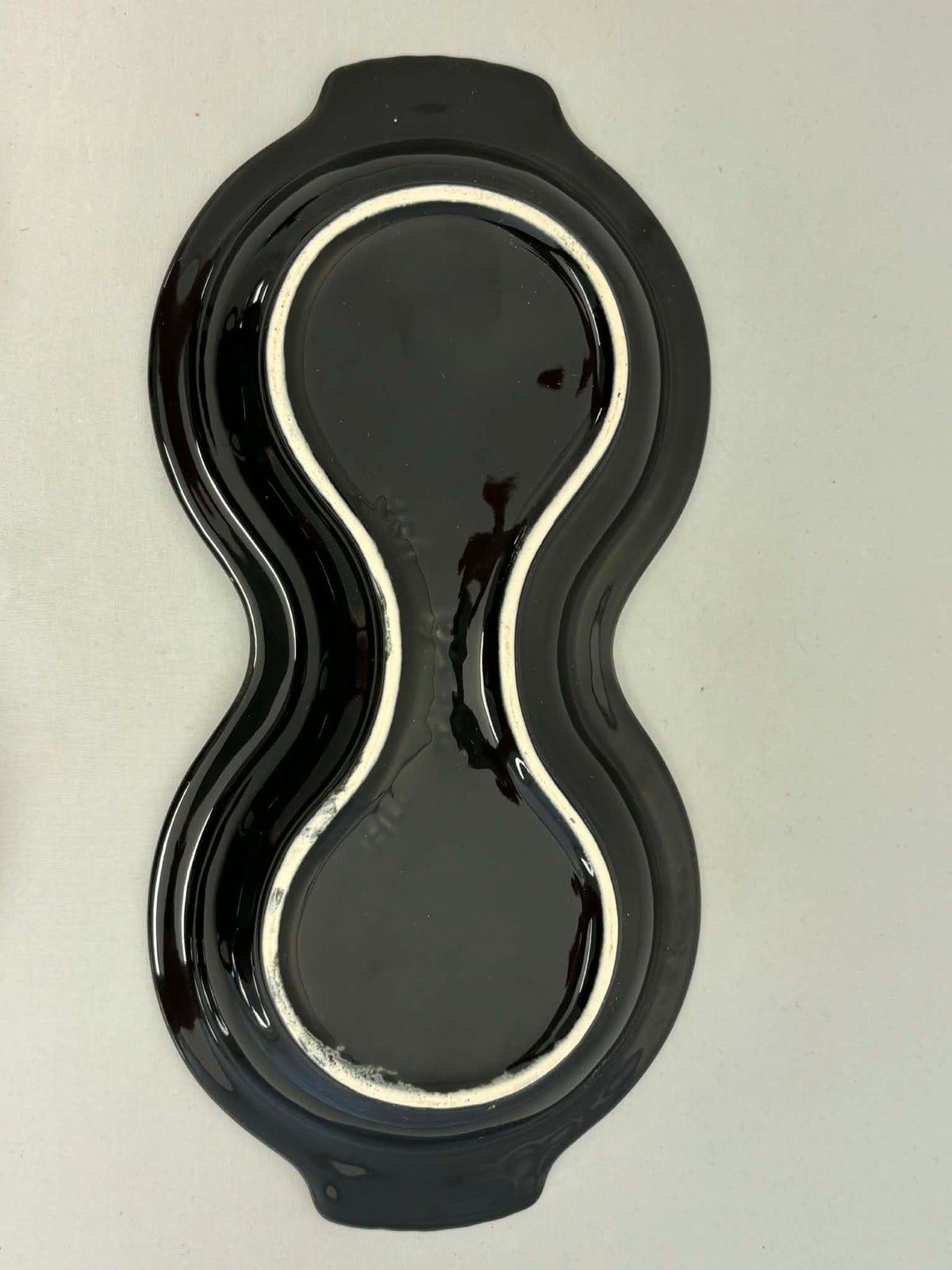 This is a Fiesta Fiestaware Creamer Pitcher Sugar Bowl with Lid on Figure Eight 8 Tray Set in black. lead-free, Post 1986, Retired Color Retired Shape
