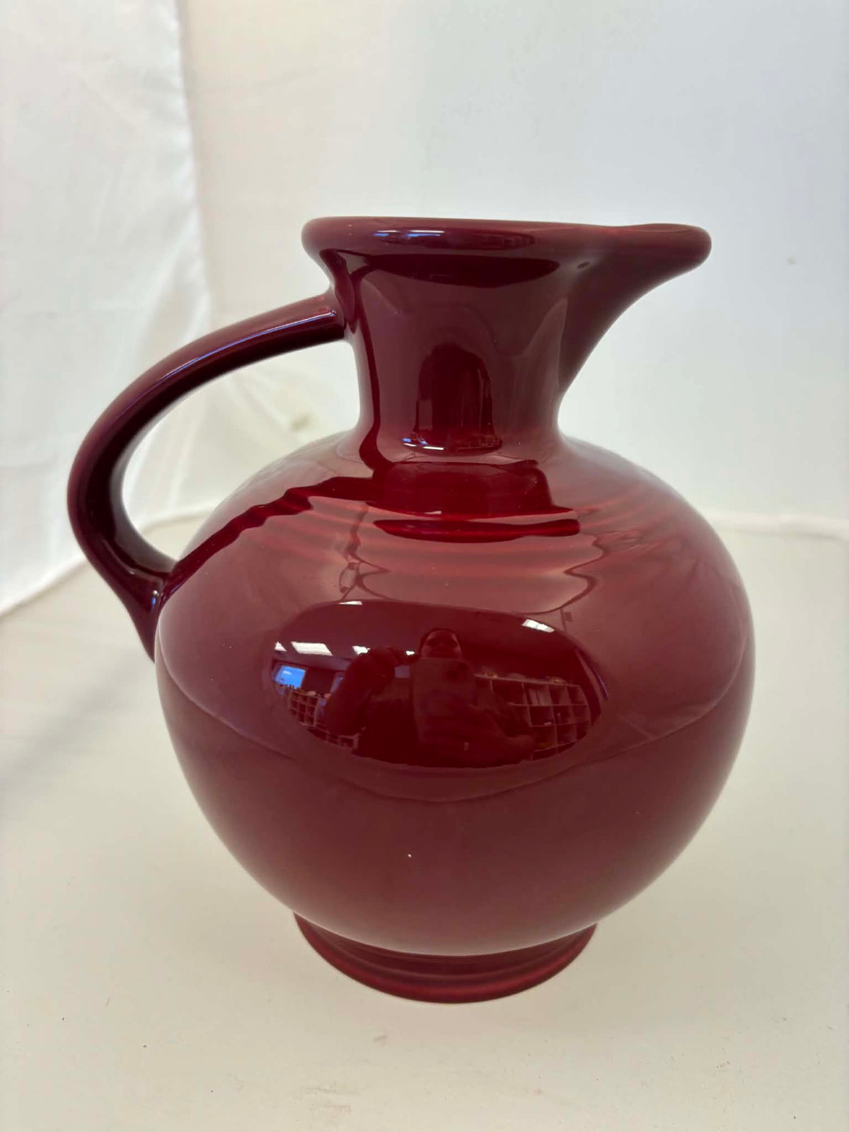 This is a Fiesta Fiestware small 60 Ounce Carafe in cinnabar. Lead-free Post 1986 Retired color retired shape
