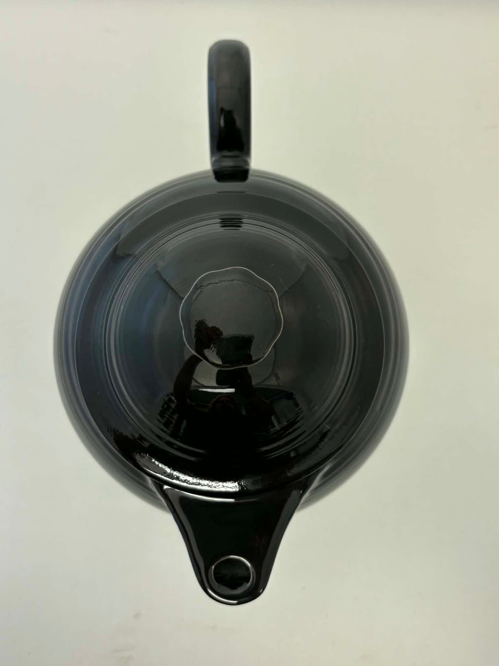 This is a Fiesta Fiestaware Five-cup 5-cup Ring Handled Tea Pot with Lid in Black. lead-free, Post 1986, Retired Color Retired Shape

