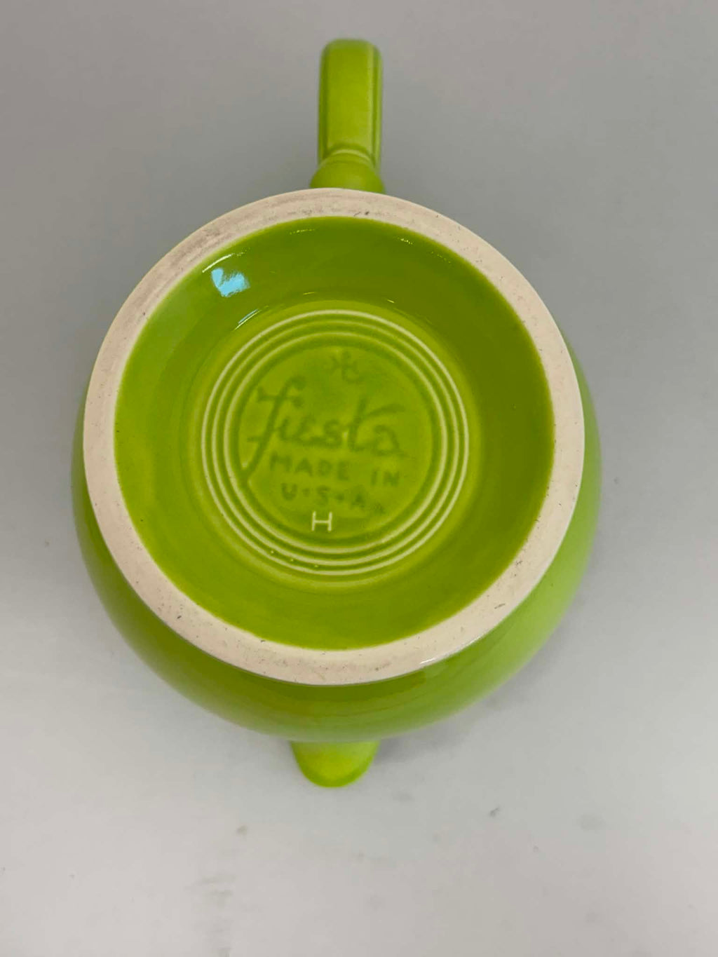 This is a Fiesta Fiestaware Five-cup 5-cup Ring Handled Tea Pot with Lid in Chartreuse. lead-free, Post 1986, Retired Color Retired Shape
