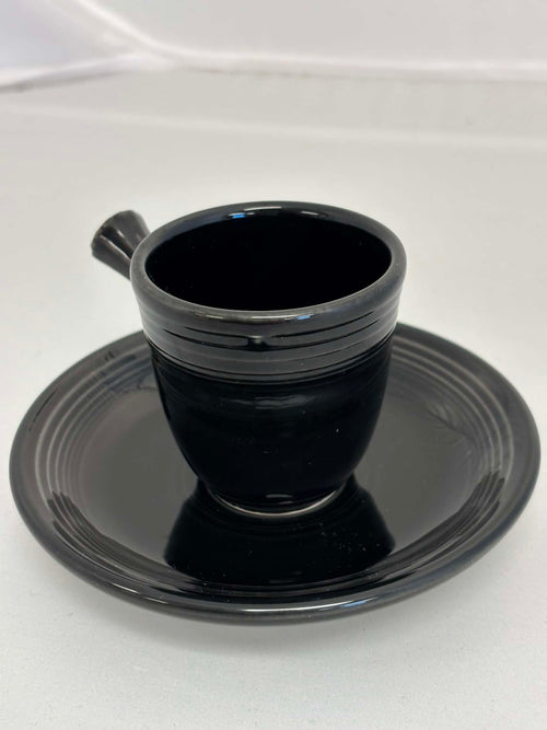 This is a Fiesta Fiestaware After Dinner AD Stick Handled Demitasse Demi Cup and Saucer Set in Black. lead-free, Post 1986, Retired Color Retired Shape Perfect for Espresso
