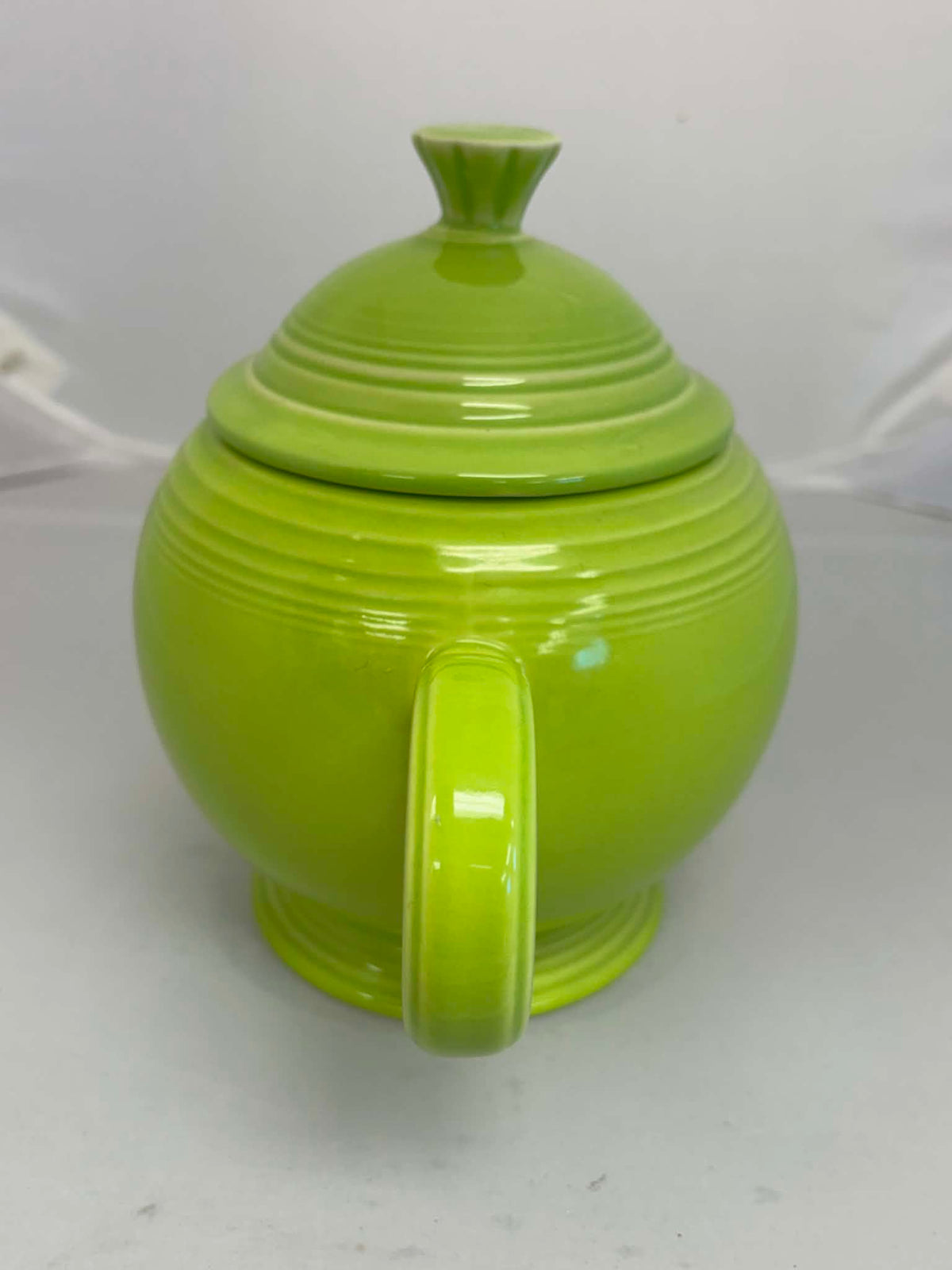This is a Fiesta Fiestaware Five-cup 5-cup Ring Handled Tea Pot with Lid in Chartreuse. lead-free, Post 1986, Retired Color Retired Shape
