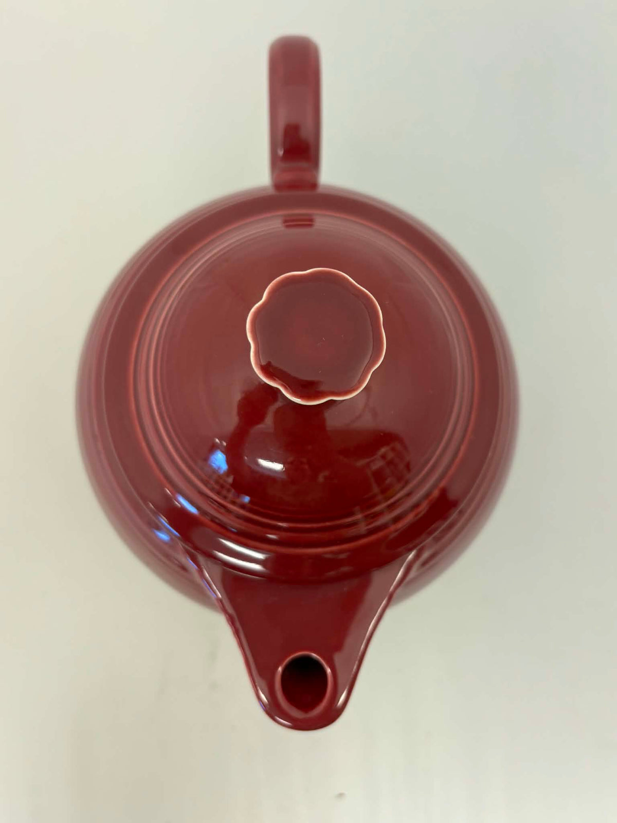 This is a Fiesta Fiestaware Five-cup 5-cup Ring Handled Tea Pot with Lid in Cinnabar. lead-free, Post 1986, Retired Color Retired Shape
