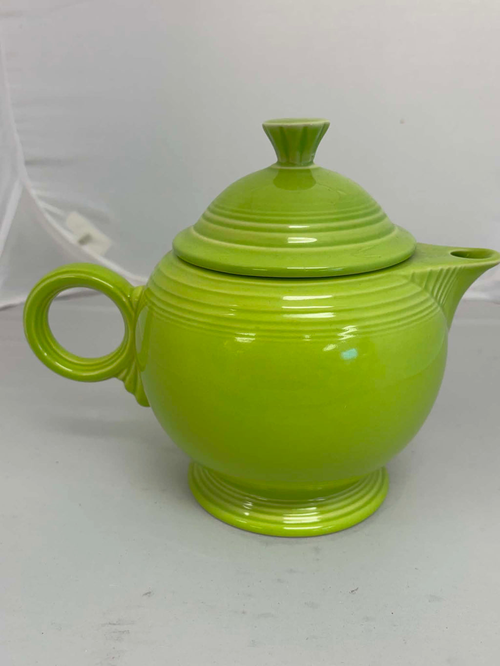 This is a Fiesta Fiestaware Five-cup 5-cup Ring Handled Tea Pot with Lid in Chartreuse. lead-free, Post 1986, Retired Color Retired Shape
